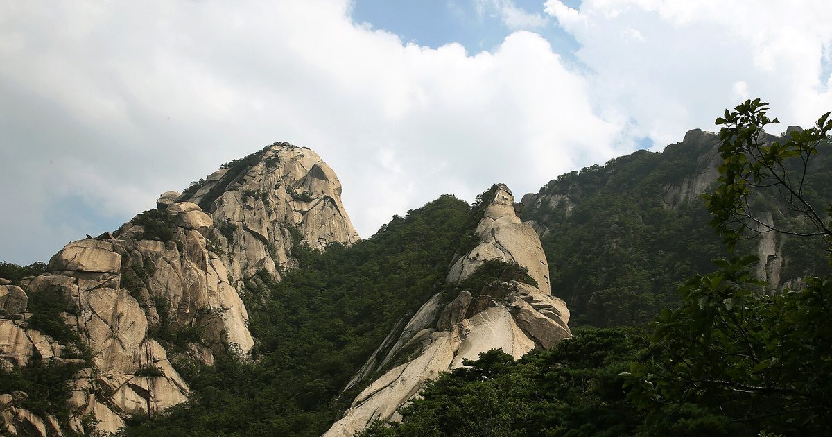 Granite peaks overlook the metropolis from the upper trail sections of Bukhansan National Park.