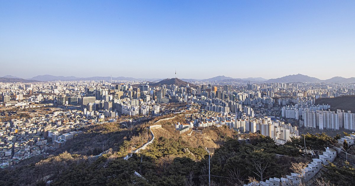 A view of N Seoul Tower over the city, where mobile navigation apps help you travel smoothly.